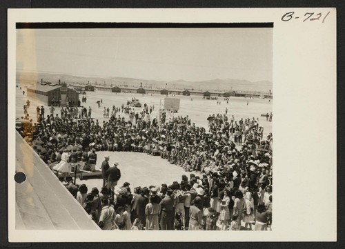 Scene at Topaz. Crowds entertained by Delta High School Band. Photographer: Bankson, Russell A. Topaz, Utah