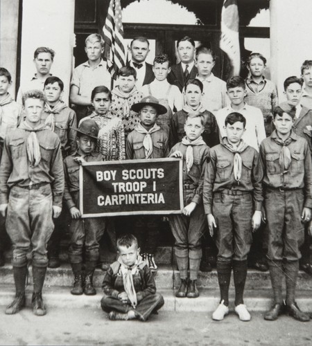 Carpinteria Boy Scout Troop with Kenji and Tom Ota in front of Carpinteria Union School : 1926. Kenji left of banner, Tom directly behind banner