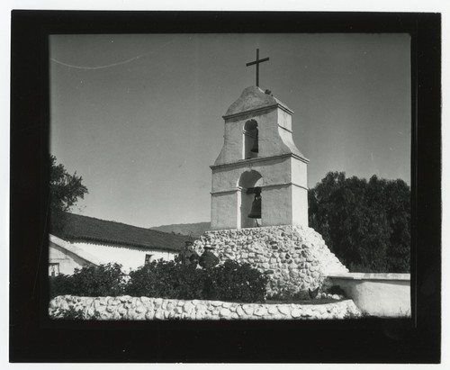 People in front of the bell tower at Pala Mission