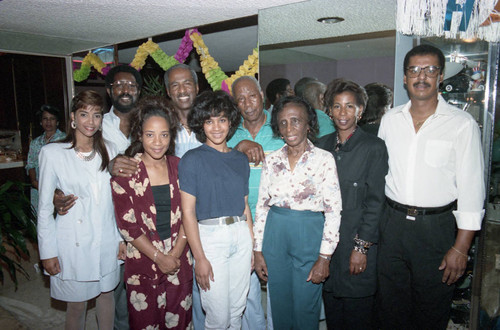 Donald Bohana posing with friends and family at his birthday party, Los Angeles, 1989