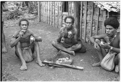 Three men eating taro: Lea'aniamae, Giri'au, Taanga