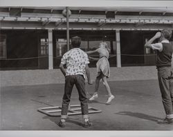 Children play tetherball at McNear School, Petaluma, California, 1960s —  Calisphere