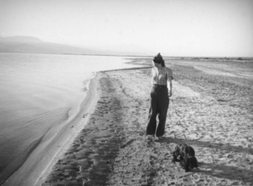 Woman with dog at the Salton Sea