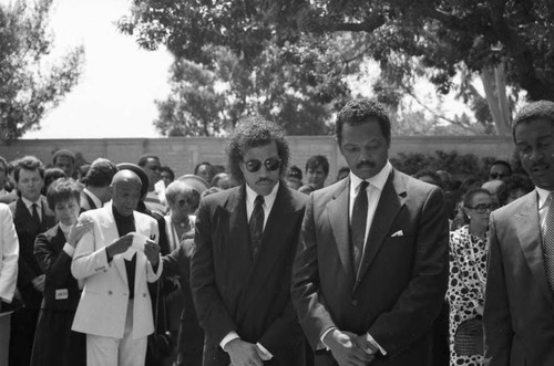 Jesse Jackson and Lionel Richie attending Sammy Davis Jr.'s funeral service, Glendale, California, 1990