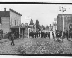 Crowd observing the flood waters on East Washington Street, Petaluma, California, 1912