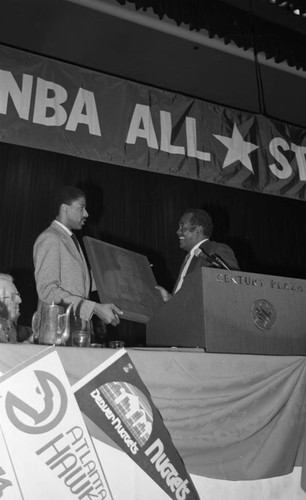 Julius Erving receiving a tribute at the NBA All-Star Game dinner, Los Angeles, 1983