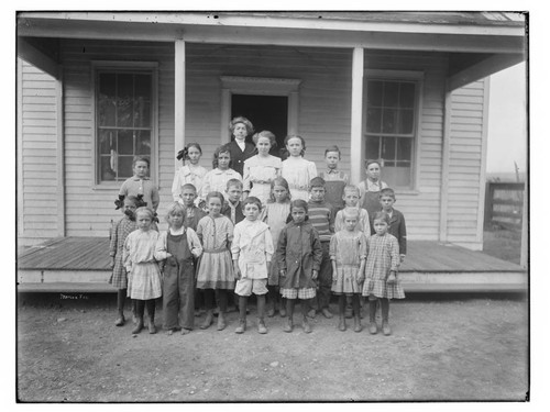 Children in front of a school in Merced Falls, Merced County