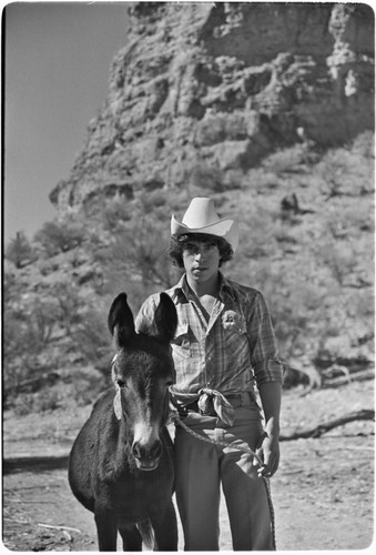Man with young mule at Rancho San Martín
