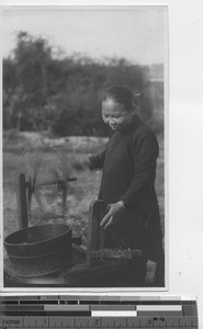 A Chinese woman making rope at Yangjiang, China, 1923