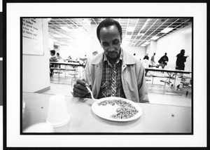 Homeless Man Picking at his Dinner, Union Rescue Mission (Los Angeles, Calif.), 1996