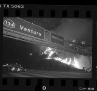 Night scene of wild fire burning along Ventura Freeway in Glendale, 1988