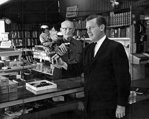 Fred A. Morgan and Bob Hudecek inspect merchandise