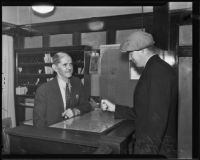 Jack Royal reenacting an attempted robbery at his hotel with Juo Tucker, Los Angeles, 1935