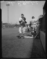 Baseball player John Bottarini with injured finger, 1936