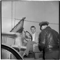 George Roberts purchases the first truck sold at the War Assets Administration's surplus truck and trailer sale, Port Hueneme, May 1946