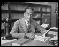 George Howard at his desk, Los Angeles