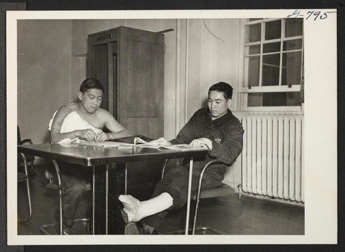 Pfc. Edwin Ohki, 21, (left) and Pvt. Ichiro (Bill) Kato, 22, wounded members of the famous 442nd Combat Team which