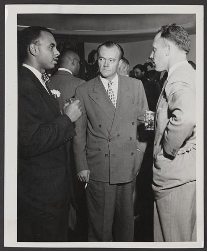 Ivan J. Houston and two unidentified individuals during Press Preview activities at the new Home Office building. 