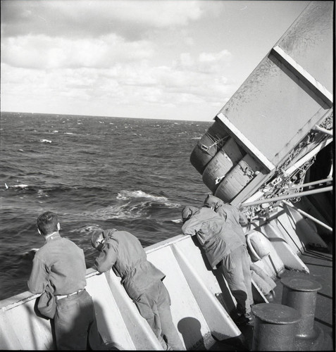 Soldiers leaning over the rails of the USS Meigs
