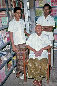Manager for DMS Bookshop Aden Mubarak Ibrahim and his two assistants Abdullah and Salim Ashur