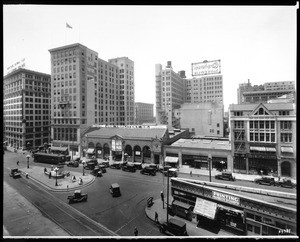 View of the junction of Main and Spring Streets near Ninth Street, looking south, showing the Joe Toplitzky Company and automobiles, ca.1926