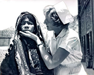 Nurse Signe Jung examines badly infected eyes of a woman