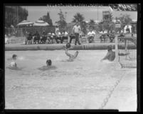 Jim Kelsey, a former UCLA Bruin star gets set to throw a goal in water polo, 1960