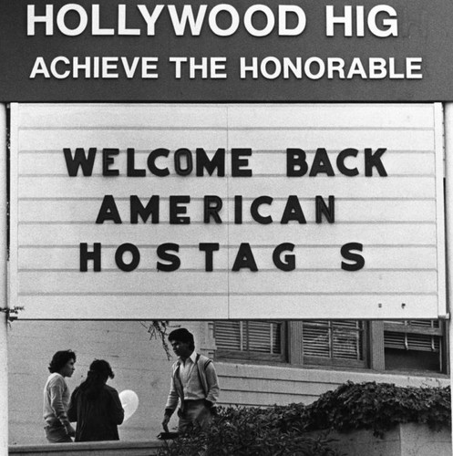 Hostages welcome sign