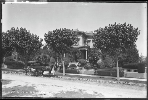 Roland G. Brown house with horse and carriage, 1389 Jackson Street, Oakland. [negative]