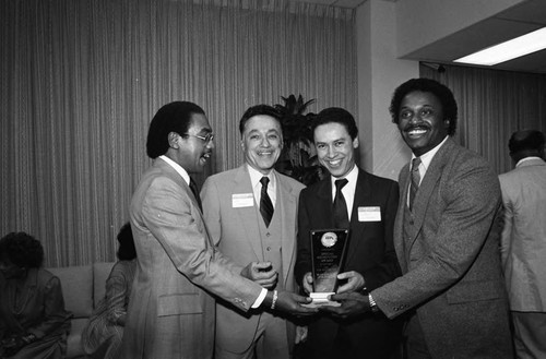 Elbert T. Hudson and Paul C. Hudson receiving an award from the Black Business Association (BBA), Los Angeles, 1984