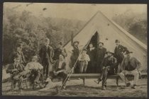 Twelve men in front of a tent, date unknown