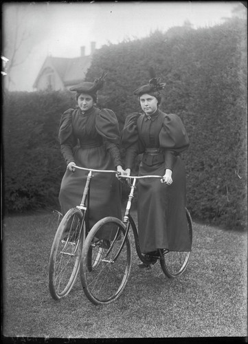 Two young women, daughters of Charles G. Yale, on bicycles. [negative]