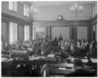 Courtroom scene from the "white flame" murder trial, where Paul A. Wright is accused of the murders of his wife and best friend, Los Angeles, 1938