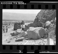 Caltrans crew at work on boulders blocking California 111, Palms Springs (vicinity), 1986
