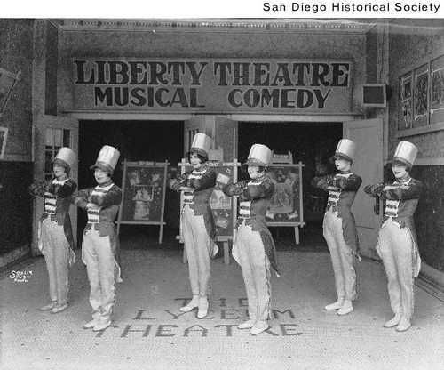 Six women dressed as toy soldiers standing outside the Liberty Theatre