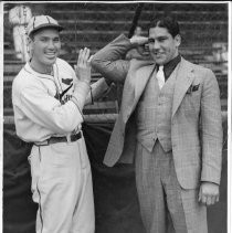 View of two athletes, on a St. Louis Cardinal baseball player (l) and the other an unknown