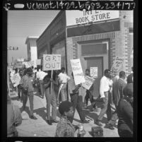 Members of the Sons of Watts picketing Worker's International Bookstore at 92nd St. and Compton Ave. in Watts, Calif., 1966