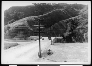 Automobiles crossing a bridge over a ravine in Los Angeles, 1930-1949
