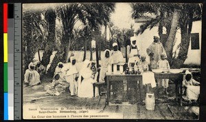 Missionary sister providing medical treatment to villagers, Algeria, ca.1920-1940