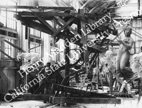 Workmen mounting framework for hindquarters of bull for sculpture "The Feast of the Sacrifice" by Albert Jaegers
