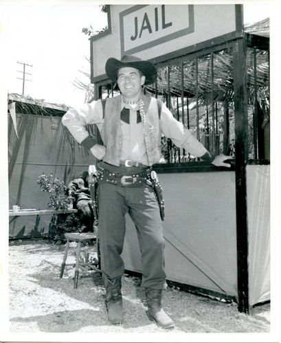 John Merrick at the jail booth for Gymkhana, 1953