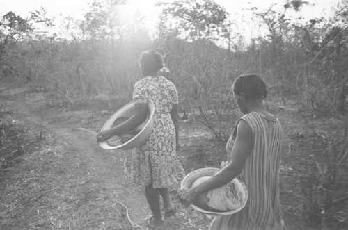 Women carrying containers, San Basilio de Palenque, Colombia, 1977