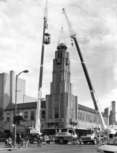 Cranes dismantling tower on Senator Theater building, March, 1999