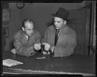 Ray Pinker and Lloyd Hurst inspect evidence from William Spinelli case, Los Angeles, 1938