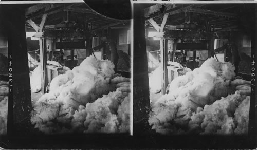 Masses of white fluffy cotton ready for the press in a ginnery, N.C. O.K. But gin mill out of season now, May 1926