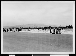 W.P.A. workers along the roadside during construction at the East San Pedro Airport, 1937