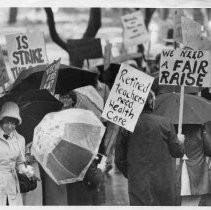 Teachers picket in the rain for better pay and benefits