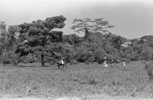 Woman and girls walking with buckets on their head, San Basilio de Palenque, 1976