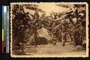Family outside a small thatched hut, Katanga, Congo, ca.1920-1940