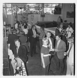 David Zumwalt and attendees at the the Zumwalt Chrysler-Plymouth Center Open House, Santa Rosa, California, 1971
